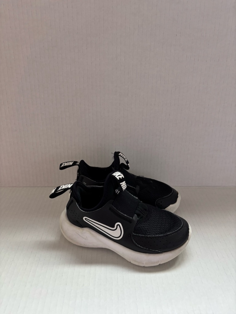 Nike Toddler Black and White Slip-On Swoosh Sneakers